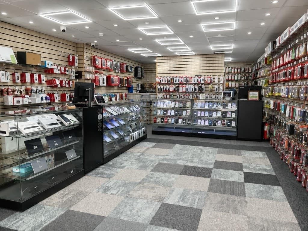 Interior of Adam's Phone Shop with display counters and accessories